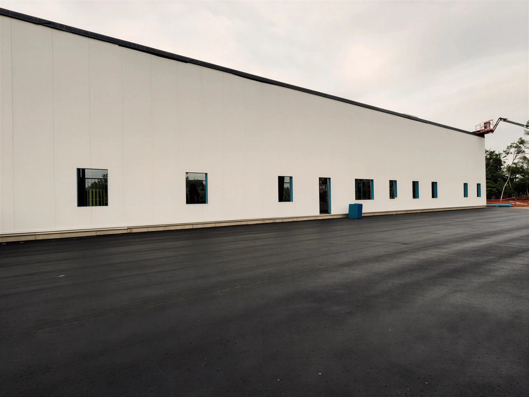 Long white commercial steel building